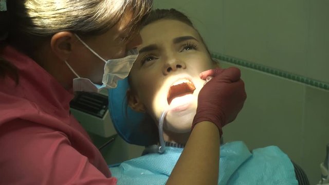 young cutie girl treats her teeth