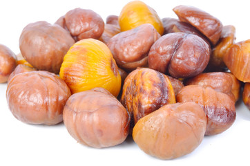 Roasted whole peeled chestnut on white background