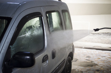 car washing cleaning car using high pressure water