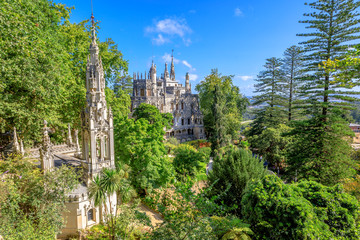 Aerial view of beautiful landscape of Regaleira Palace in Sintra, Portugal. Sunny day, blue sky. - obrazy, fototapety, plakaty