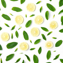Pattern of mint and lemon. Food background with citrus. Mint leaves, lemon slices isolated on white background. Top view, flat lay.	