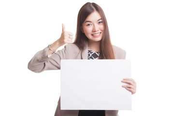 Fototapeta premium Young Asian woman show thumbs up with white blank sign.