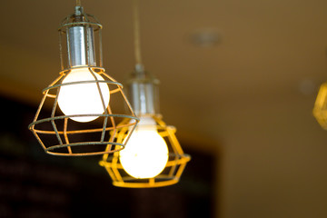 Fototapeta na wymiar Old light bulbs and bokeh light background close up.