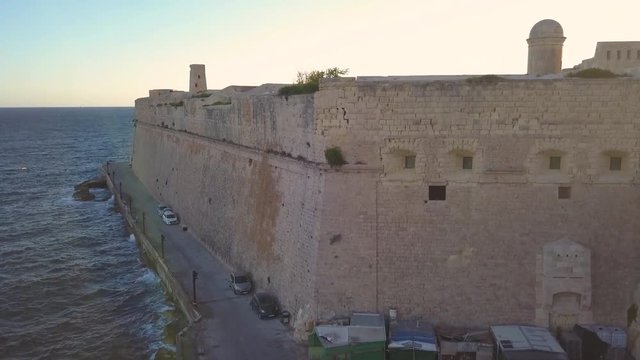 rising over St Elmo fort in Valletta Malta