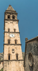 View of the old church in the Mediterranean city in Montenegro Perast in Kotor Bay, the Italian Venetian style of architecture and white brick.