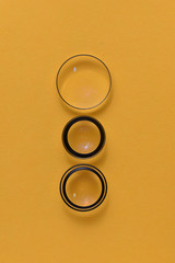 Three lenses on a yellow background