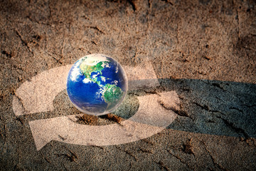 Earth and recycling arrows on the floor, Save our world concept, Elements of this image furnished by NASA