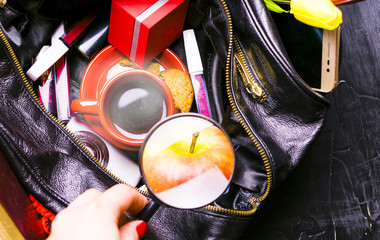 A girl can't find something in my bag. Mess.