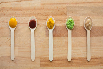 vegetable or fruit puree or baby food in spoons
