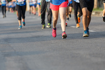 Fototapeta na wymiar Marathon runners focus clear running shoes on the street.