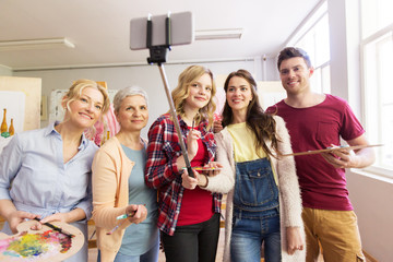 group of artists taking selfie at art school