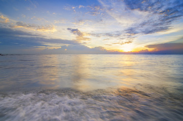 Fototapeta premium Beautiful and calm beach with dead mangroves during sunset