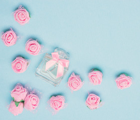Perfume bottle with bow and pink roses