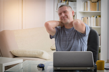 Man suffering from neck pain