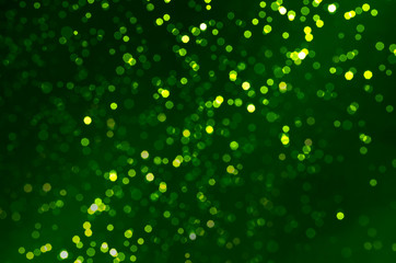 abstract green bokeh for christmas and happy new years celebration background.