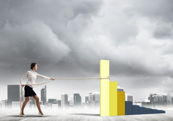 Businesswoman pulling arrow with rope and making it raise up