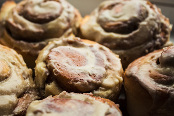 cinnabon rolls with cream cheese glaze on plate