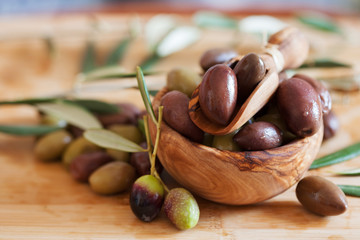 olives on wooden background, kalamata, kalamon, green olives