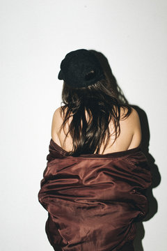 Woman in Hat & Bomber Jacket
