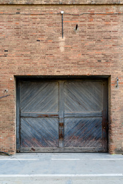 Old brick wall with wooden door
