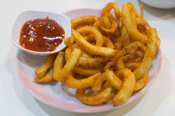 Homemade fast food portion of french fries with Tomato sauces