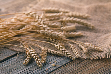 ears of rye on rustic wooden table