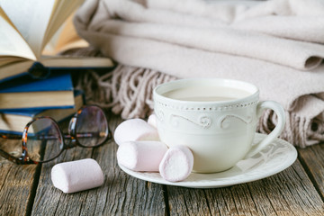 Cozy breakfast with warm plait and hot tea with milk
