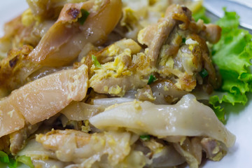 Stir fried flat noodle and chicken and egg Thai street food