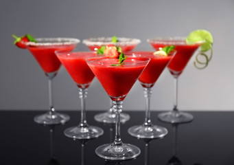 Glasses of delicious strawberry daiquiri on table