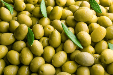 Many green olives as background