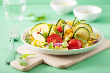 spiralized courgette salad with sweetcorn tomato avocado, healthy vegan meal