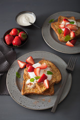 french toasts with yogurt and strawberries for breakfast