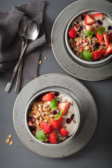 granola and yogurt with seeds and strawberry for breakfast