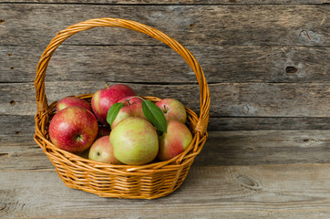 Red ripe apples in a basket