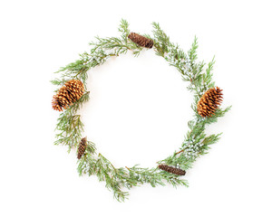 Christmas round frame made of evergreens and cones