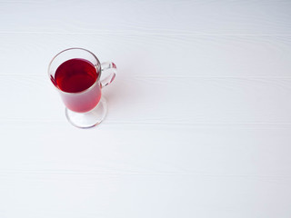 a glass of mulled wine, one for white background, space for text