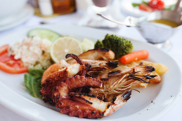 Fresh mixed seafood plate with vegetables