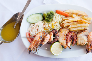Fresh mixed seafood plate with vegetables