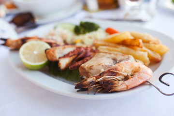 Fresh mixed seafood plate with vegetables