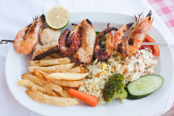 Fresh mixed seafood plate with vegetables