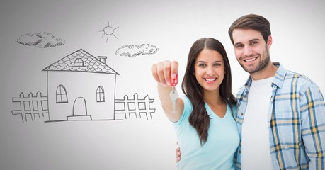 Couple Holding key with home drawing in front of vignette