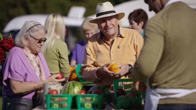  Senior couple shopping at a farmers market