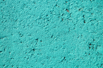 Fototapeta na wymiar Closeup of the texture of aquamarine road paint.