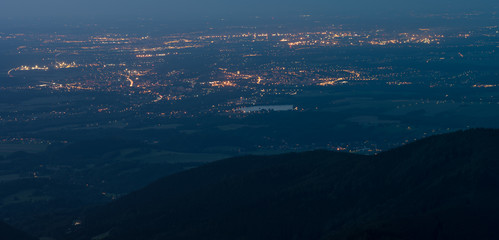 Naklejka na ściany i meble Night view from Lysa peak, Lysa hora direction Ostrava, Beskydy mountains, Czech Republic