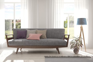 Idea of white room with sofa and summer landscape in window. Scandinavian interior design. 3D illustration