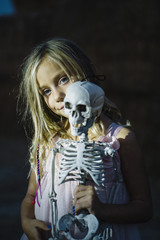  beautiful Little girl with  skeleton, halloween