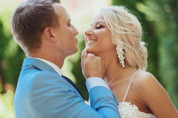 Fototapeta premium The young couple, the beginning of family life - a wedding, a portrait of the groom and bride is in love