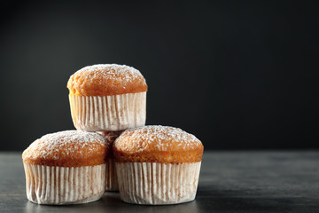 Delicious carrot muffins on dark background