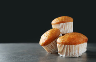 Delicious carrot muffins on dark background