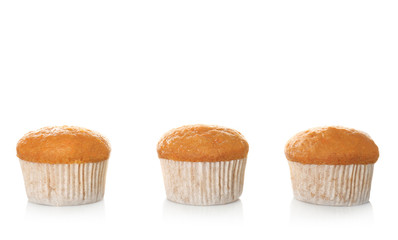 Delicious carrot muffins on white background